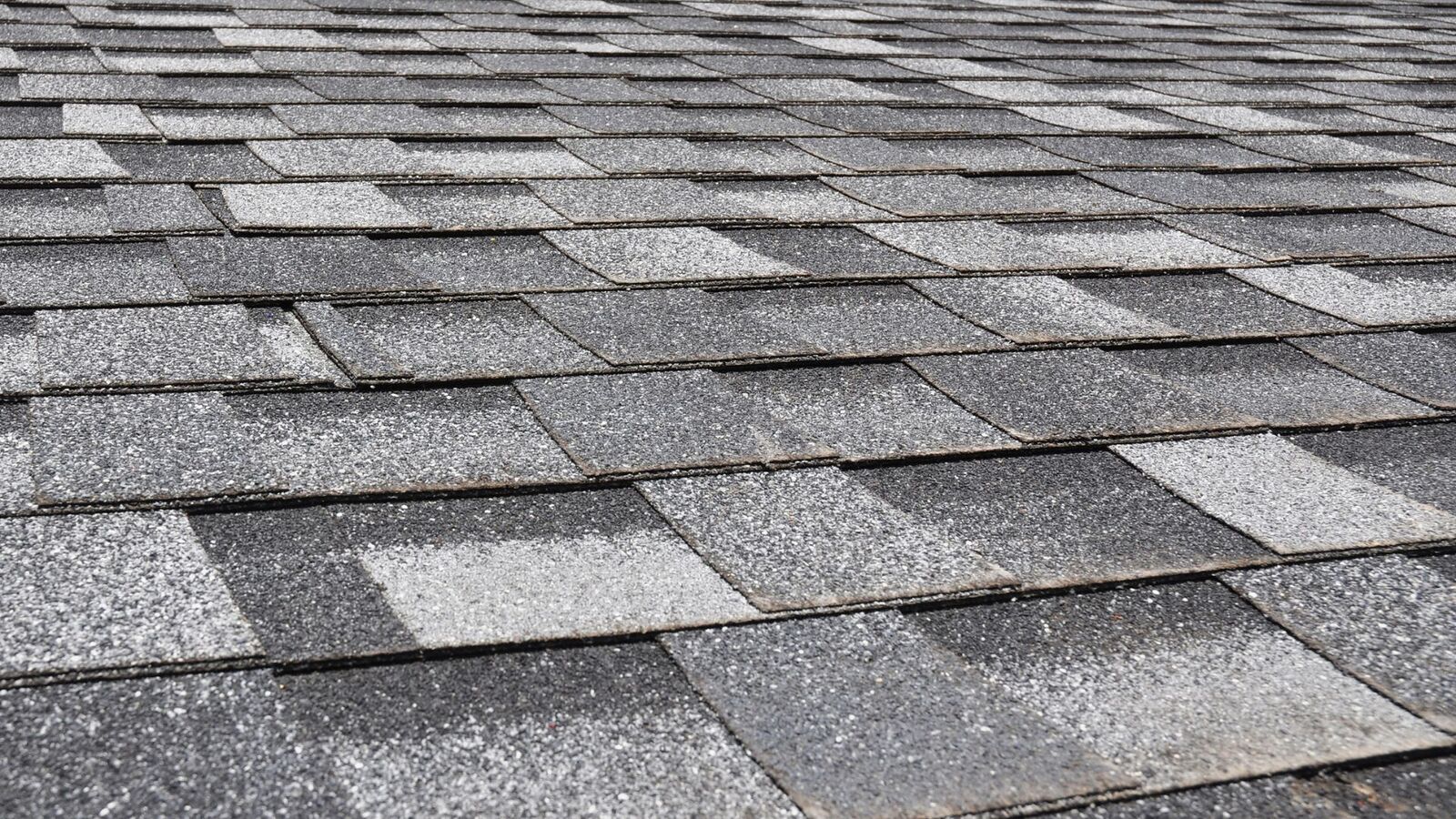 Close-up of architectural asphalt shingles on a new roof installation