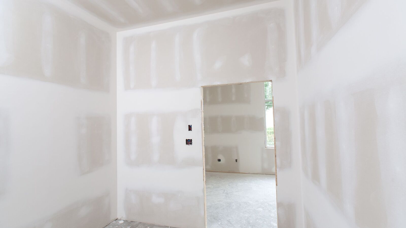 Fresh drywall installed and finished during a home addition
