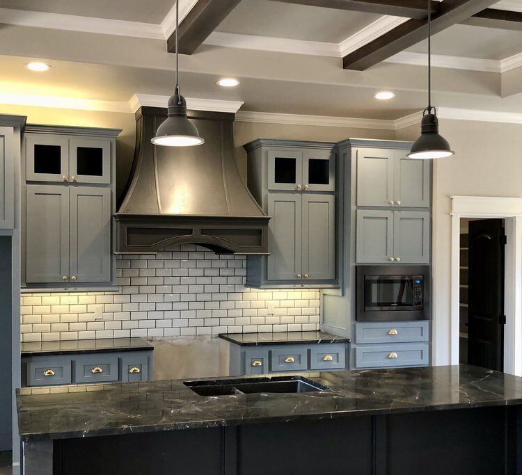 Finished kitchen remodel with custom gray cabinets, coffered ceiling, and island in Oklahoma