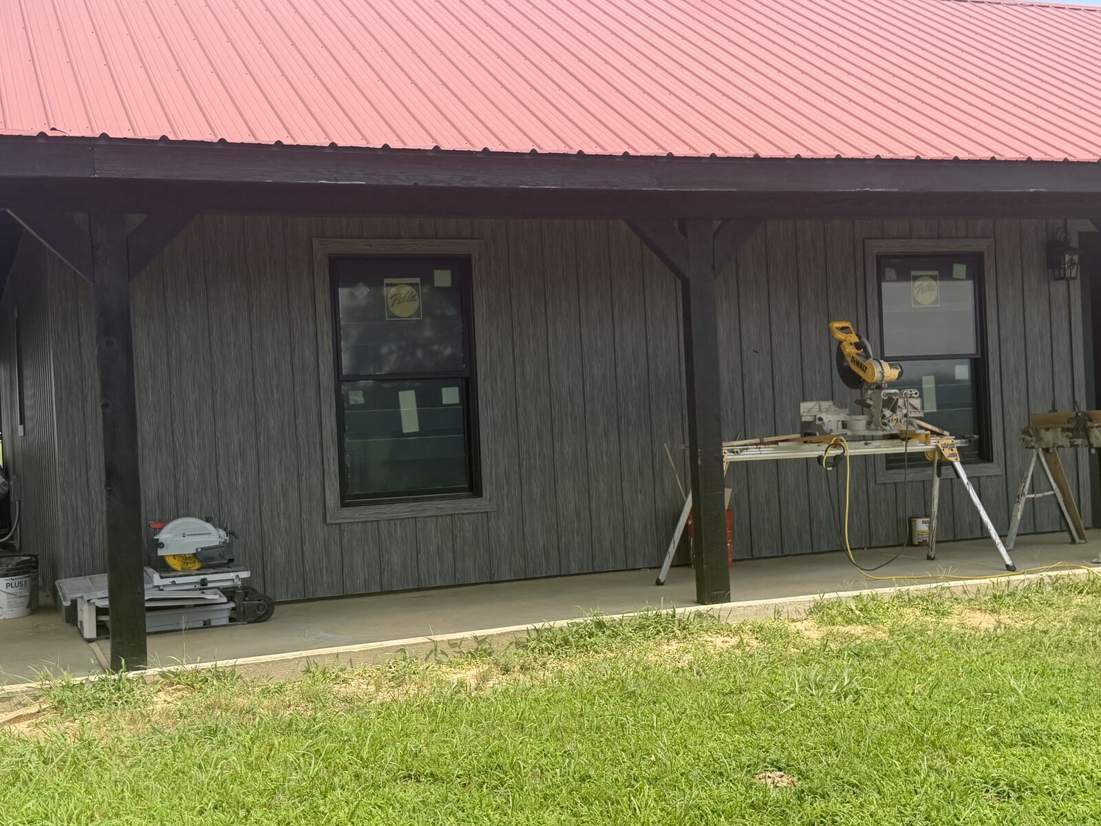 New construction home with covered porch and board-and-batten siding in Seminole County, OK